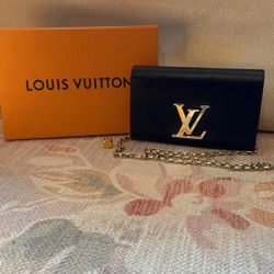 Louis Vuitton clutch with chain shoulder strap