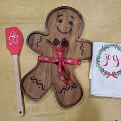 New, super cute real wooden gingerbread man serving platter, spatula and towel.