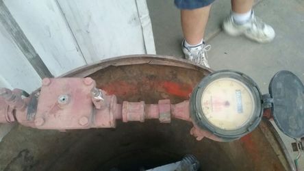 Three-quarter inch water meter with a backflow preventer