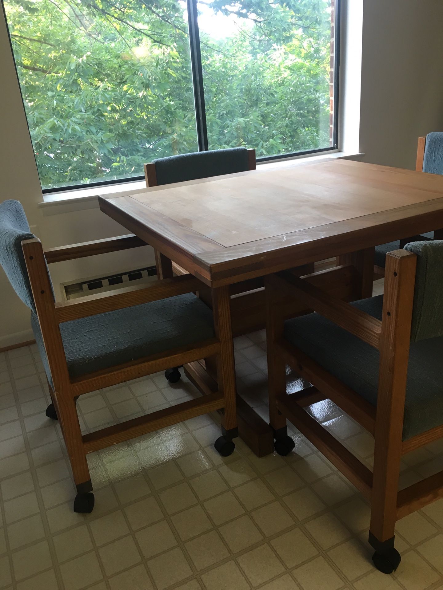 Kitchen table set with four very comfortable upholstered chairs.