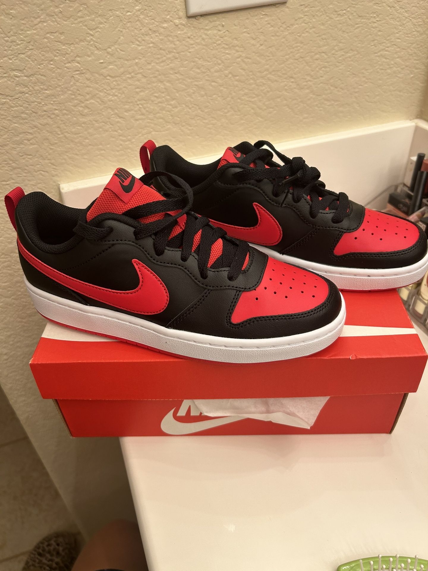 red and black nike shoes