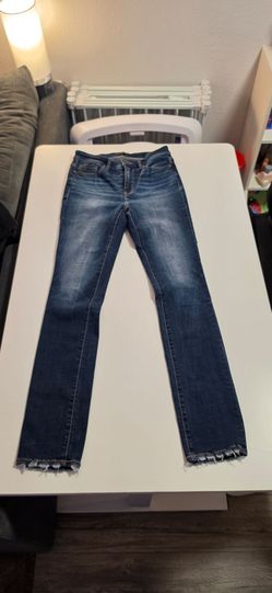 Buckle black skinny jeans