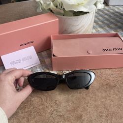 Miu Miu black cat-eye sunglasses