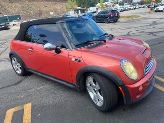 2005 orange mini cooper S convertible super charger