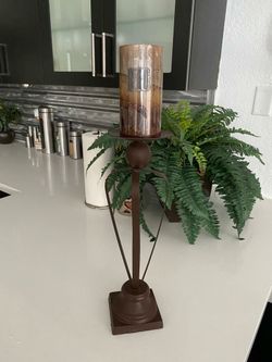 Single bronze colour candle holder