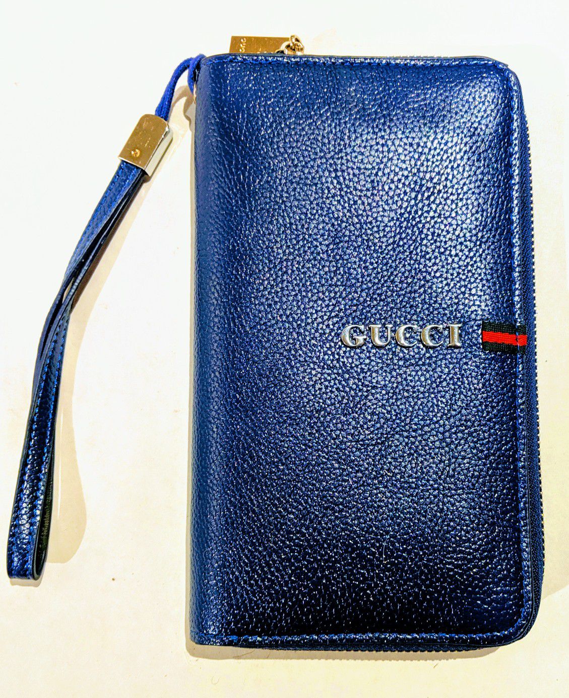 GUCCI blue zip around wallet with wrist strap