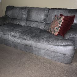 2 Gray leather couch’s 