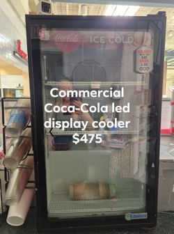 Commercial Coca-Cola display LED light cooler.