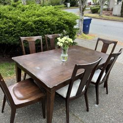 Wooden table and six chairs