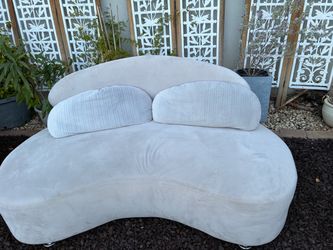 66” long x 33” wide Crescent-Shaped Light Cream Velvet Sofa