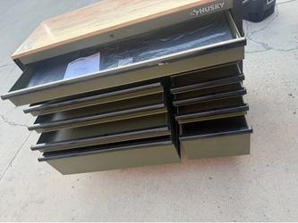 Husky Standard-Duty 52 in. W 10-Drawer Matte Army Green Mobile Workbench Cabinet with Solid Wood Top brand new has some Scratches on the back and smal
