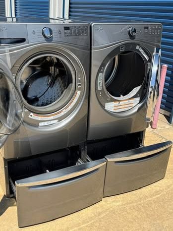 Graphite steel front load whirlpool washer and front load whirlpool dryer with pedestals working perfectly with warranty extra for delivery same day