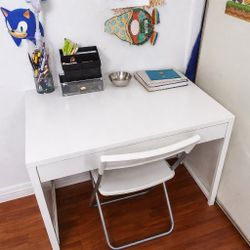 White Desk and Folding Chair