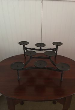 Candle holder (cast iron) ideal for a fireplace that is not in use.