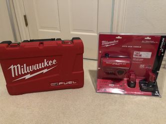 Milwaukee m12 hammer drill impact kit with a spare battery and soft bag