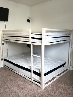 Bunk beds, with two full sized mattresses