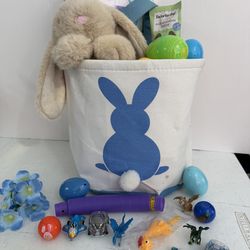 Easter basket for boy. Blue tones with bunny and beach ball, bunny chocolate, eggs and small toys. Small stain 🫟 last photo