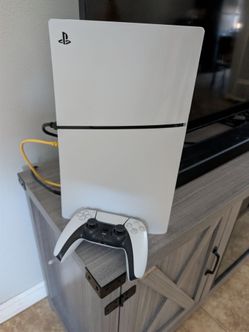 PlayStation 5 Disc Version with controller and cables