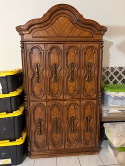 Vintage Wood Armoire with Ornate Carved Doors