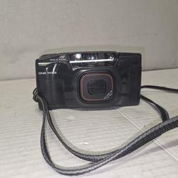 Ricoh shot master camera
35 mm film
Works 
F=38-76mm