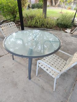 51" wide x 28" tall, nice clean patio table with 2 chairs