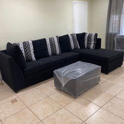 Black Sectional With Designed Pillows 