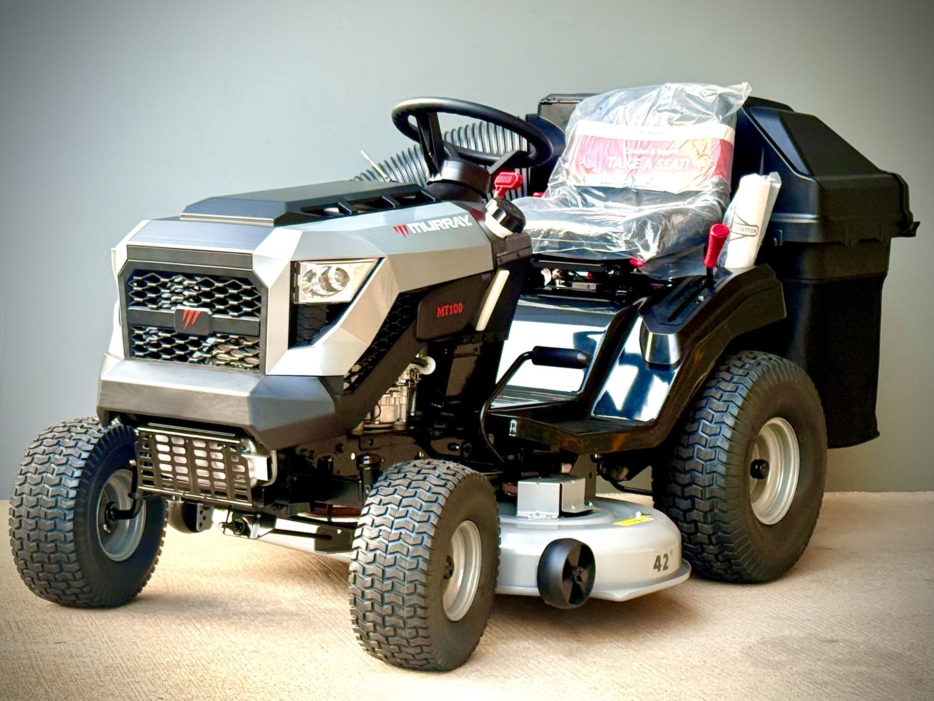 Brand new MurrayMT100 42 in. 13.5 HP 500cc E1350 Series Briggs and Stratton Engine 6-Speed Manual Gas Riding Lawn Tractor Mower comes with bagger.