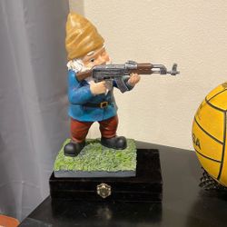GNOME Holding Machine Gun Decor.