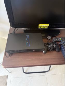 PlayStation 2 with games