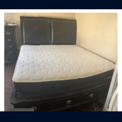 A King sized bed frame and two  night stands. Mattress not included. 
