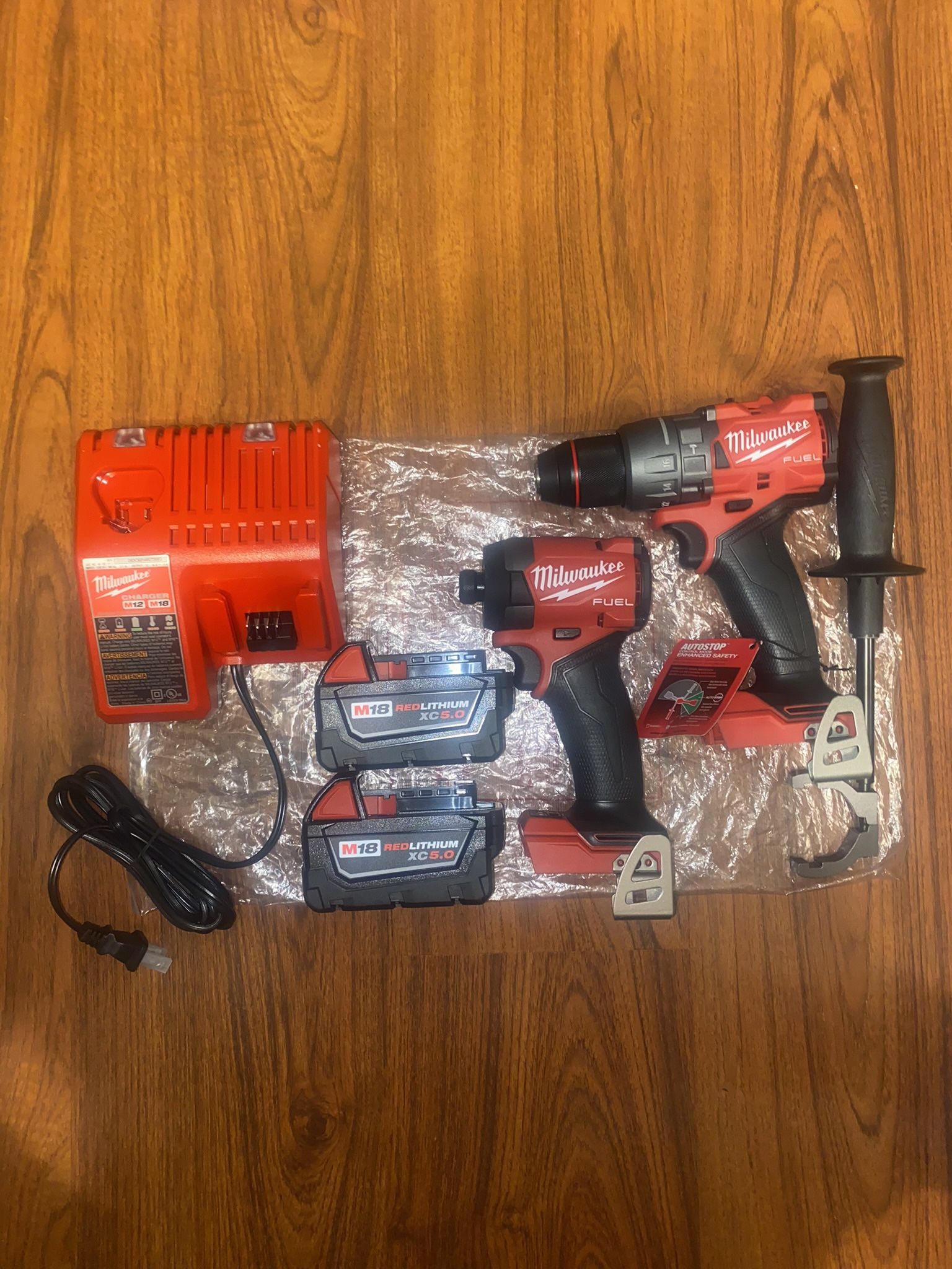 (1) Milwaukee M18  Fuel Hammer Drill/Driver(2904-20)  (1)M18 Fuel Impact Driver(2953-20)  (2) M18 5.0 Ah XC Battery  (1) M12/M18 Charger
