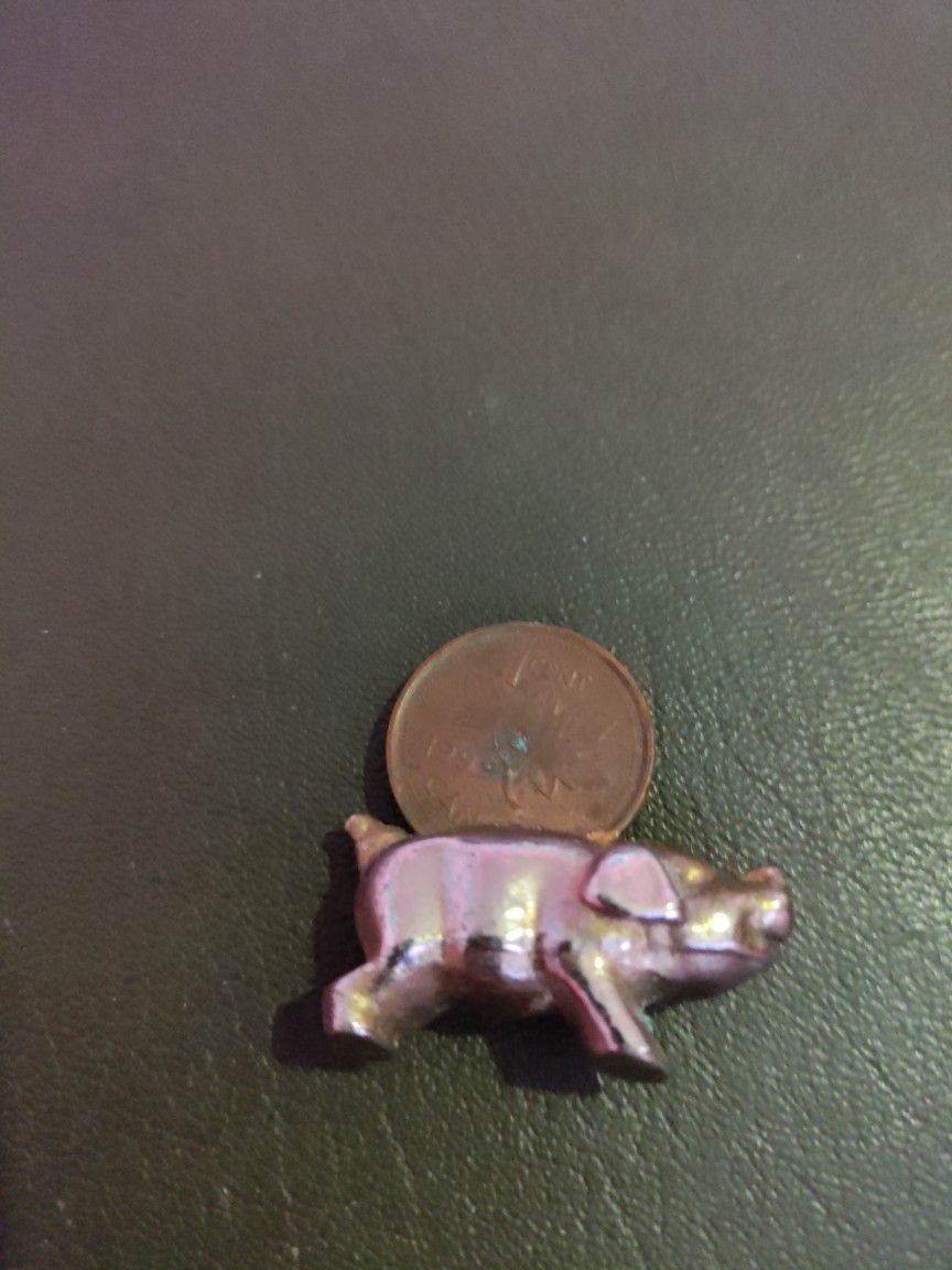 1999 Canadian Penny Fused Into A Pig.
