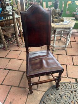 Set of four Spanish leather wood chairs