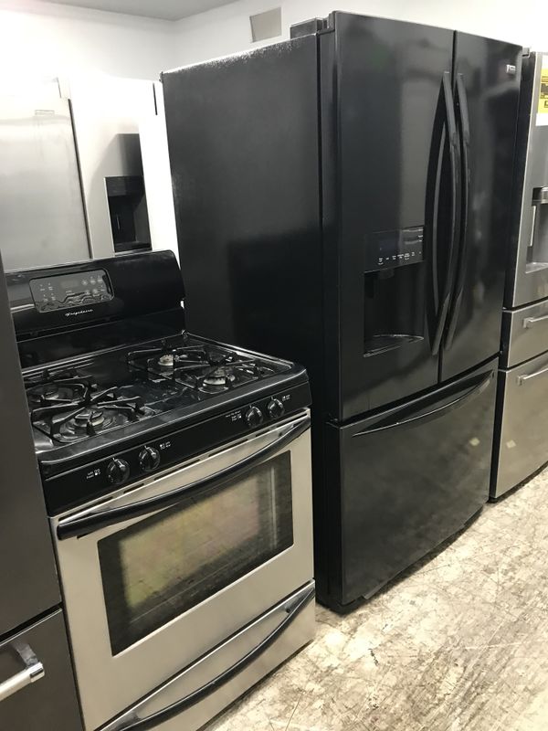 Black bundle refrigerator and stove clean w/warranty for Sale in
