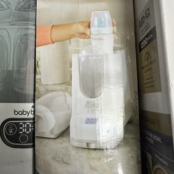 The First Years 4-in-1 Remote Control Bottle Warmer. 