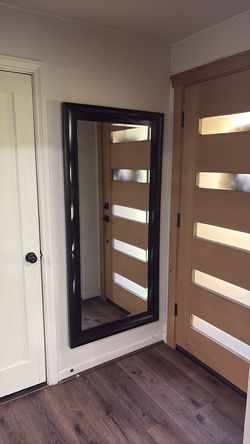 Large wall mounted mirror with a minor flaw