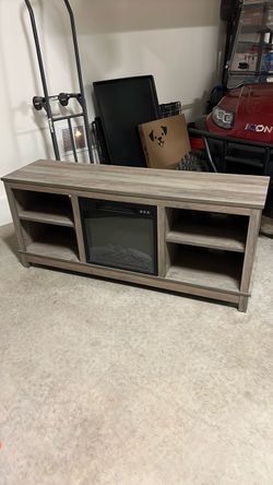 Entertainment center with fireplace.