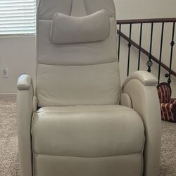 A Set Of Two Zero Gravity Off White Leather Chairs Plus A Dark Grey Leather Recliner Two Seated Couch