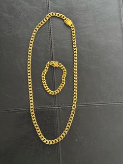 chain and bracelet. Long 30” . Stanley steel. Used in good condition