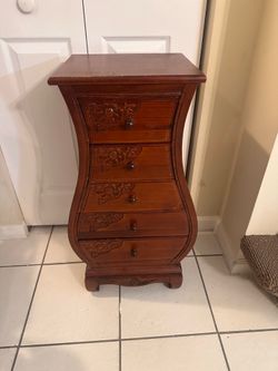 Beautiful solid wood jewelry armoire in very good condition.