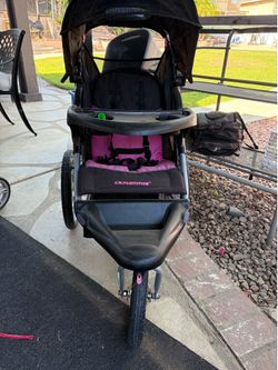 Pink and black expedition jogging stroller