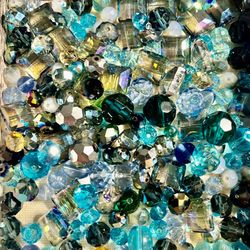 Vibrant aqua and teal bead mix adds sparkle to craft and decor projects. Includes assorted shapes and finishes for layered texture and shine. Perfect 