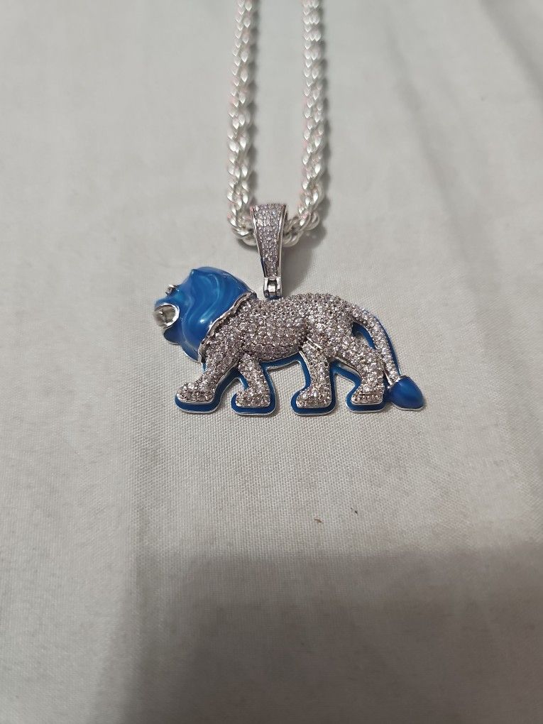 Sterling Silver Moissanite Lion Pendant And 4mm 30in Sterling Silver Chain.