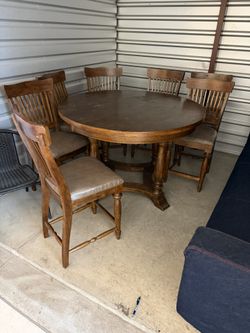Table top 54”around H36” Very good condition wood table with 7 matching chairs