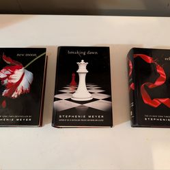Hardcover books from Twilight Saga Twilight, New Moon, Breaking Dawn, and Eclipse.