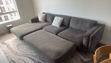 Grey Couch with Rug