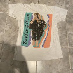 The shirt does have some light stains that even make the shirt look cool the tag did fade away please refer to the images for purchase thank you