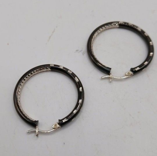 Glossy Black Diamond Cut Hoop Earrings in Sterling SilverCrafted in .925