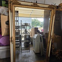 Large wooden mirror with gold accent