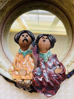 Studio art pottery-Carol Kaminski-vintage-lovers sitting on bottom edge of mirror